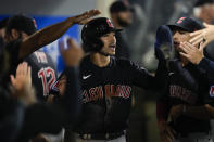 Cleveland Guardians' Steven Kwan, right, celebrates in the dugout after scoring off of a single hit by Josh Naylor during the seventh inning of a baseball game against the Los Angeles Angels in Anaheim, Calif., Thursday, Sept. 7, 2023. (AP Photo/Ashley Landis)