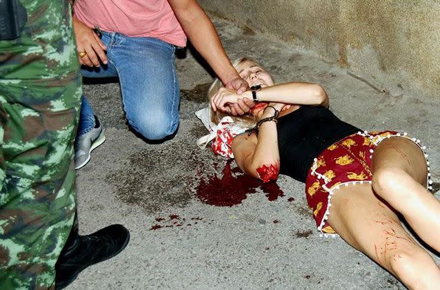An injured woman receives first aid after two bombs exploded in the Thai seaside resort of Hua Hin. Picture: Reuters