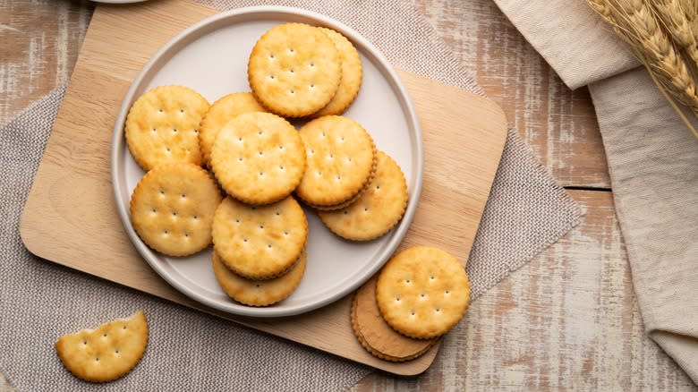 Round butter crackers on plate