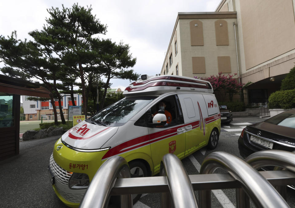 An ambulance leaves Songchon High School in Daejeon, South Korea, Friday, Aug. 4, 2023. South Korean police are chasing the suspect in a stabbing attack at the high school in the central city of Daejeon, a day after another stabbing incident at a shopping mall in the city of Seongnam, south of Seoul, leaving multiple people wounded. (Kim Jun-beom/Yonhap via AP)