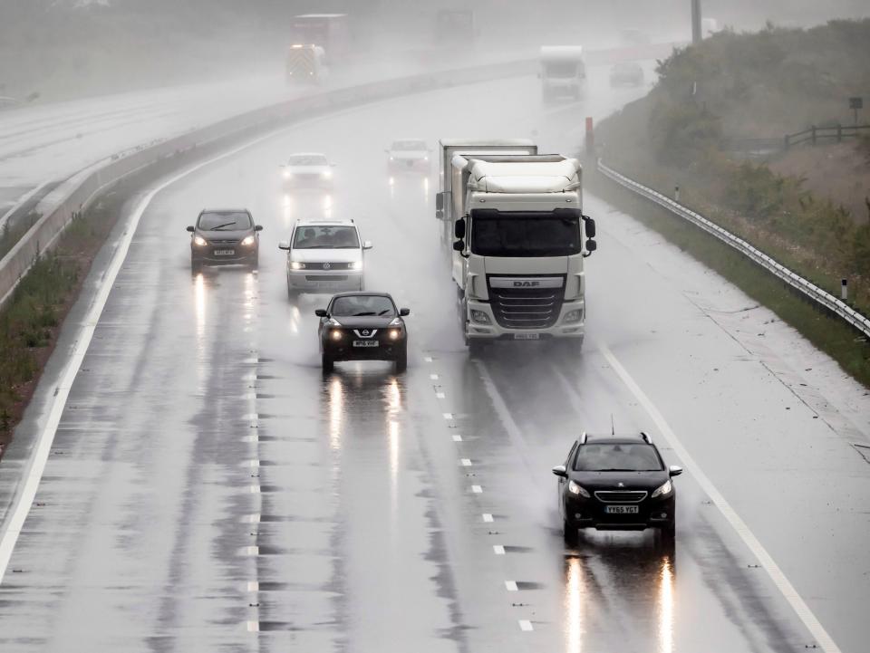 Torrential rain on the A1 near Leeming in Yorkshire on what is expected to be the hottest day of the year (PA)