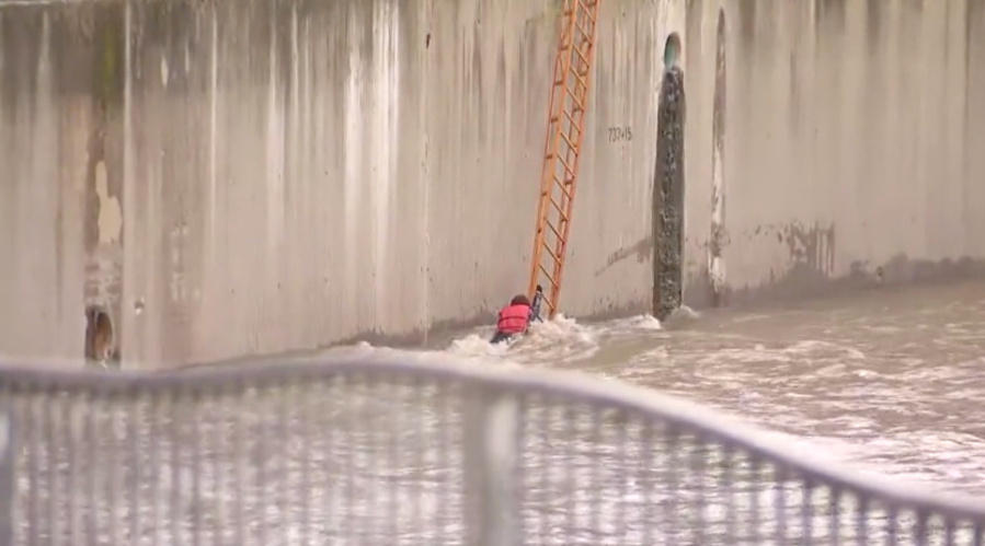 Firefighters rescue woman from storm-flooded L.A. River