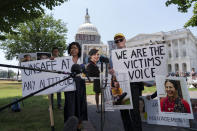 Chris and Clariss Moore parents of Danielle, one of the crash victims of a Boeing 737 MAX8 in Ethiopia, holding her photographs, speaks during a news conference on Capitol Hill, Tuesday, June 18, 2024, in Washington. ( AP Photo/Jose Luis Magana)