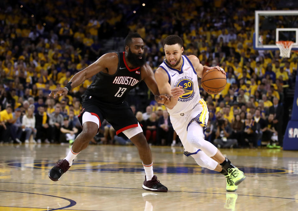 OAKLAND, CALIFORNIA - MAY 08:   James Harden #13 of the Houston Rockets guards Stephen Curry #30 of the Golden State Warriors during Game Five of the Western Conference Semifinals of the 2019 NBA Playoffs at ORACLE Arena on May 08, 2019 in Oakland, California.  NOTE TO USER: User expressly acknowledges and agrees that, by downloading and or using this photograph, User is consenting to the terms and conditions of the Getty Images License Agreement.  (Photo by Ezra Shaw/Getty Images)