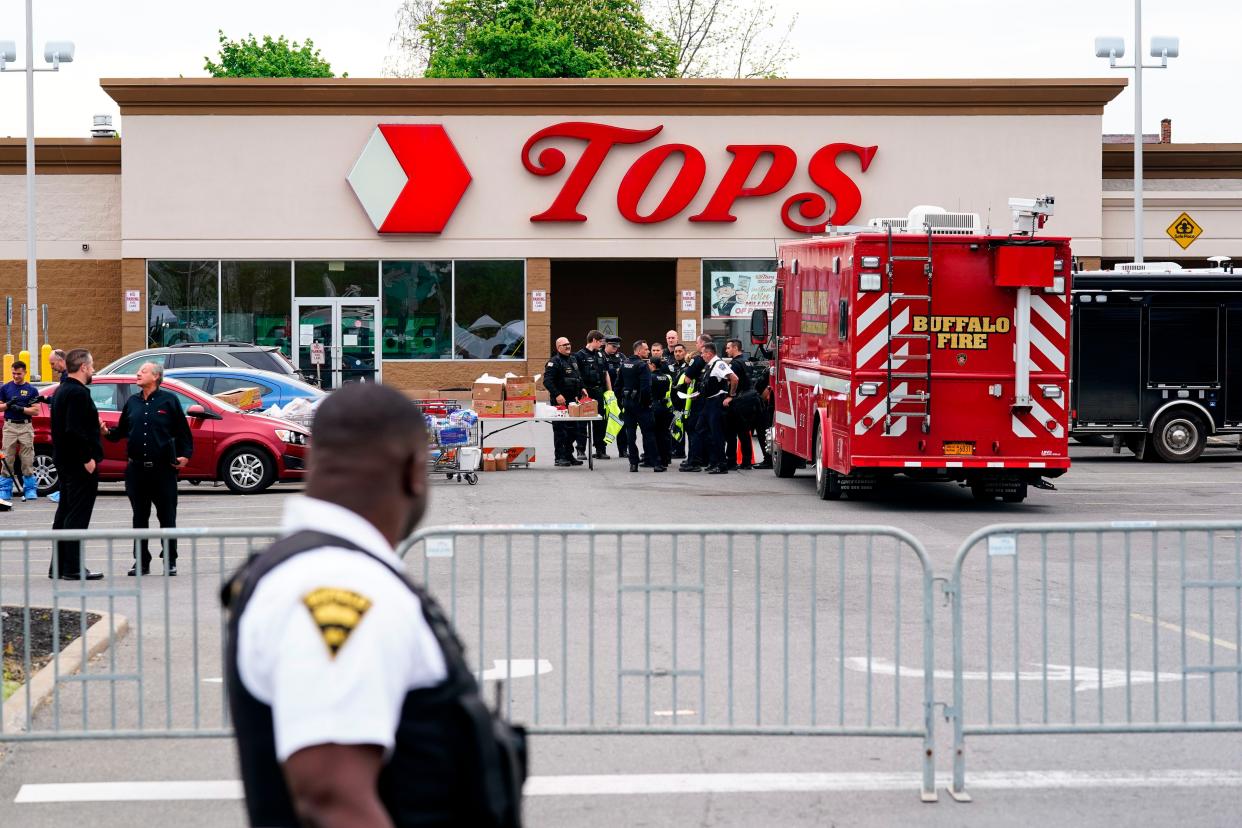 Investigators work the scene of a shooting at a supermarket, in Buffalo, N.Y., Monday, May 16, 2022.