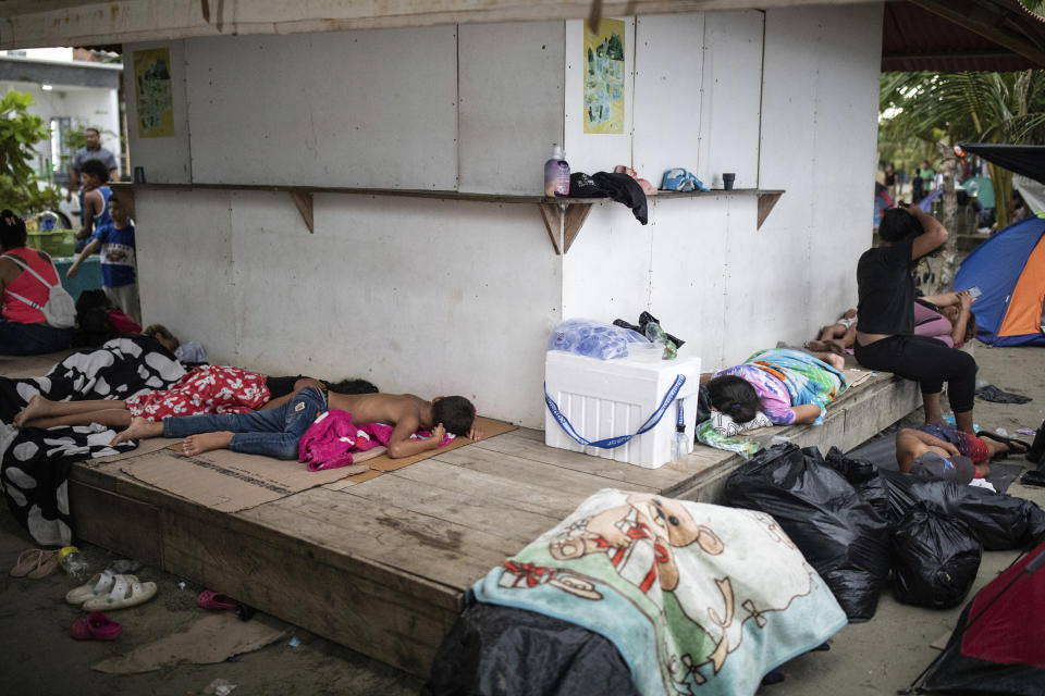 Migrants sleep on the beach, in Necocli, Colombia, Saturday, Oct. 7, 2023. New York City Mayor Eric Adams has capped off a four-day trip to Latin America with a visit to the northern Colombian city where thousands of migrants start the trek across the Darien jungle, as they head to the United States. (AP Photo/Ivan Valencia)