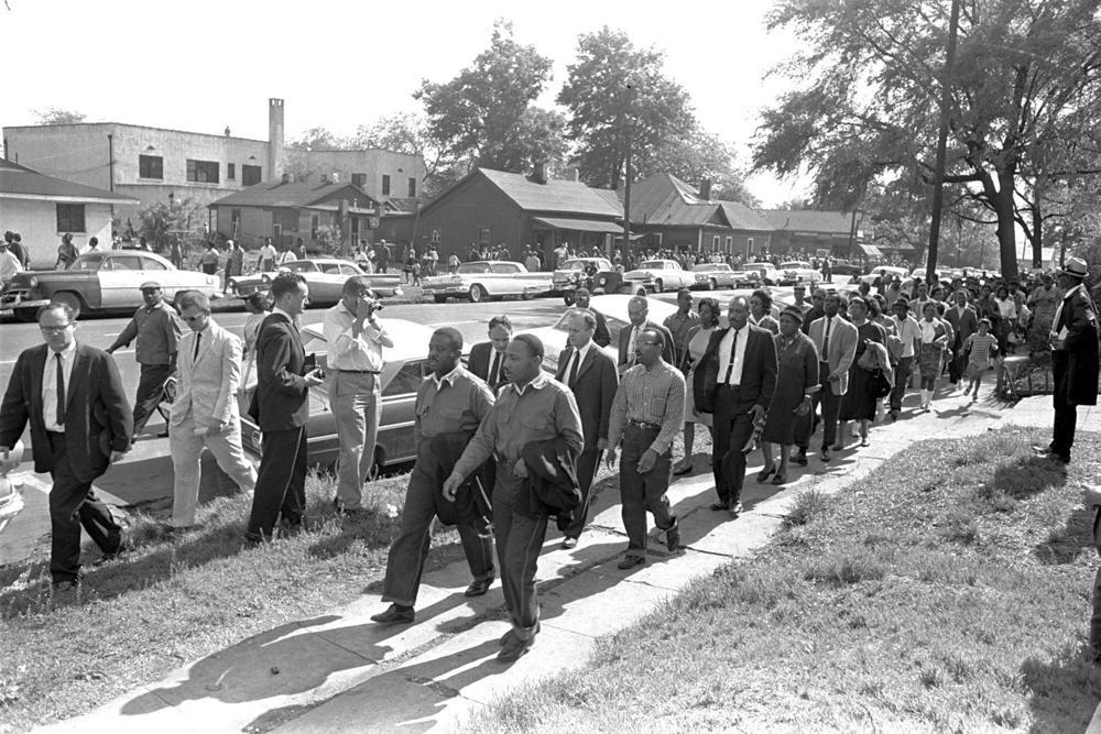 Rev. Ralph Abernathy, left, and Rev. Martin Luther King Jr. lead a column of demonstrators as they attempt to march on Birmingham, Ala., city hall April 12, 1963. (AP Photo/Horace Cort)