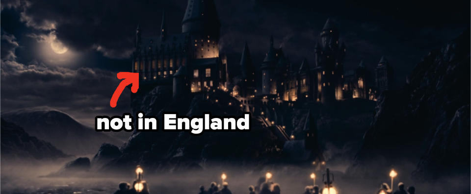 A distant view of illuminated Hogwarts Castle at night, with a crescent moon in the sky, from the Harry Potter movies. labeled "not in England"