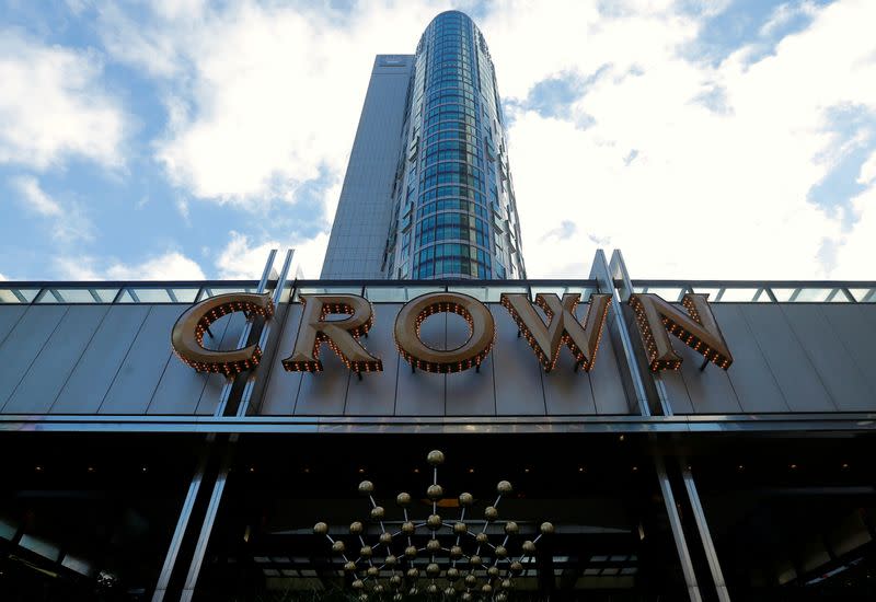 FILE PHOTO: The logo of Australian casino giant Crown Resorts Ltd adorns a hotel and casino complex in Melbourne, Australia