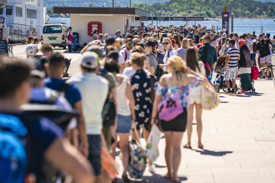 People wait to take a ferry in Norway as coronavirus restrictions lift. Source: AAP