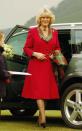 Camilla makes her first official engagement with new husband Prince Charles in 2005 in a below-the-knee red coat.