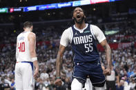 Dallas Mavericks forward Derrick Jones Jr., right, celebrates after scoring as Los Angeles Clippers center Ivica Zubac stands by during the second half in Game 5 of an NBA basketball first-round playoff series Wednesday, May 1, 2024, in Los Angeles. (AP Photo/Mark J. Terrill)