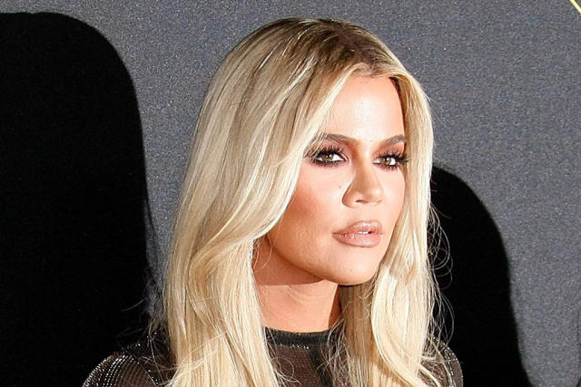 Khloe Kardashian sports e a knee brace during yet another gym session