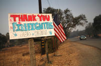 <p>A sign thanking firefighters is posted on Highway 12 on Oct. 12, 2017 in Sonoma, Calif. (Photo: Justin Sullivan/Getty Images) </p>