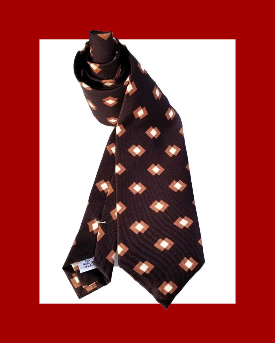 <p><a href="https://xofpentacles.com/collections/ties/products/retro-block-print-macclesfield-silk-tie-chocolate-brown" rel="nofollow noopener" target="_blank" data-ylk="slk:Shop Now;elm:context_link;itc:0;sec:content-canvas" class="link ">Shop Now</a></p><p>Retro Block Print Silk Tie</p><p>$125.00</p>