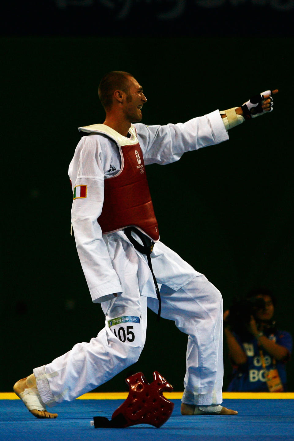 BEIJING - AUGUST 22: Mauro Sarmiento of Italy celebrates after winning the Men's Taekwondo 80kg Semifinal fight against Aaron Cook of Great Britain at the University of Science and Technology Beijing Gymnasium on Day 14 of the Beijing 2008 Olympic Games on August 22, 2008 in Beijing, China. (Photo by Quinn Rooney/Getty Images)