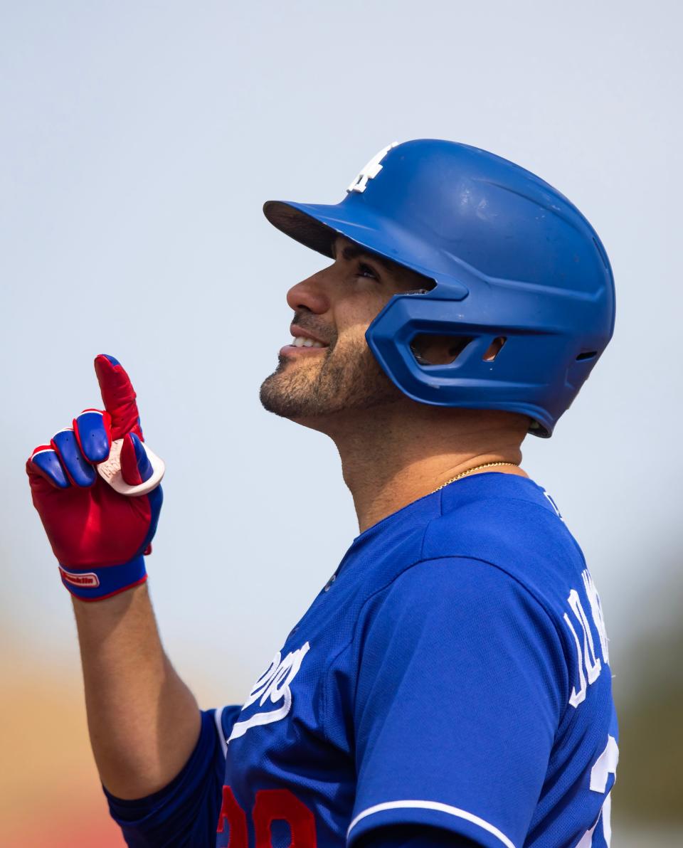 Dodgers DH J.D. Martinez celebrates a hit against the Padres.