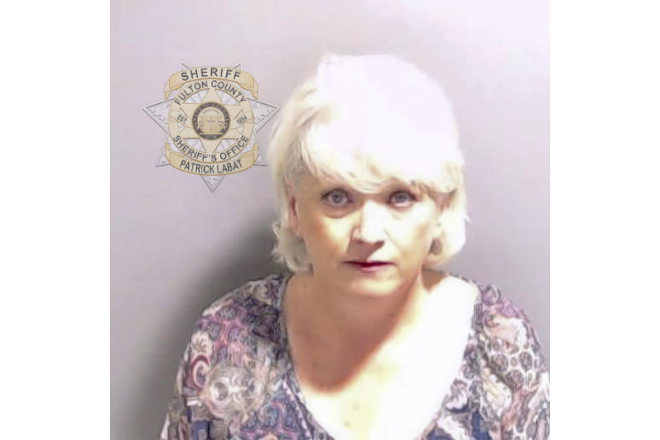 This booking photo provided by the Fulton County Sheriff's Office shows Cathleen Latham on Wednesday, Aug. 23, 2023, in Atlanta, after she surrendered and was booked. Latham is charged alongside former President Donald Trump and 17 others, who are accused by Fulton County District Attorney Fani Willis of scheming to subvert the will of Georgia voters to keep the Republican president in the White House after he lost to Democrat Joe Biden. (Fulton County Sheriff's Office via AP)