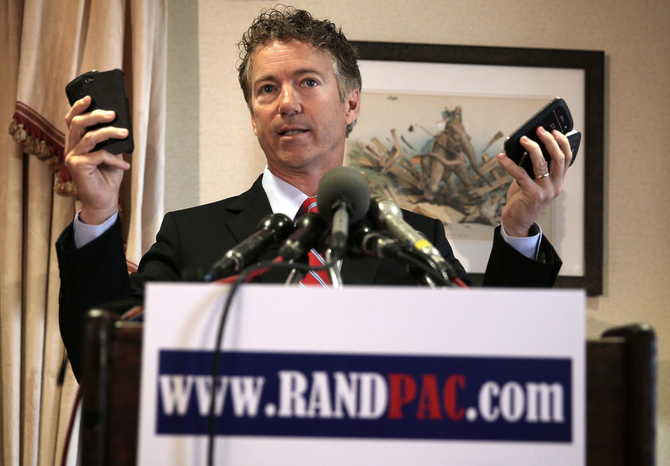 WASHINGTON, DC - JUNE 13:  U.S. Senator Rand Paul (R-KY) holds up a few cellular phones as he speaks during a news conference June 13, 2013 at the Capitol Hill Club on Capitol Hill in Washington, DC. Senator Paul was joined by lawmakers and other groups to discuss the National Security Agency's surveillance program.  (Photo by Alex Wong/Getty Images)