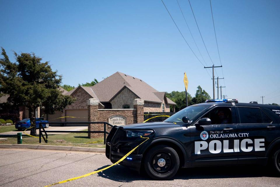 <p>NATHAN J. FISH/THE OKLAHOMAN / USA TODAY NETWORK</p> Police investigate after 5 were found dead in a home near Yukon in Oklahoma City
