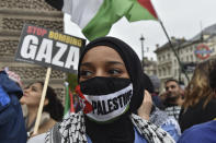 Pro-Palestinian protesters take part in a demonstration in London, Saturday, April 27, 2024. (AP Photo/Thomas Krych)