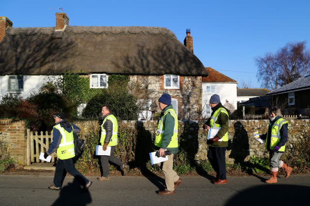 Sussex Police Search Volunteers head out to deliver information leaflets in the village of Bosham in 2014 (Gareth Fuller/PA)