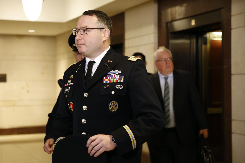 Army Lieutenant Colonel Alexander Vindman, a military officer at the National Security Council, center, arrives on Capitol Hill in Washington, Tuesday, Oct. 29, 2019, to appear before a House Committee on Foreign Affairs, Permanent Select Committee on Intelligence, and Committee on Oversight and Reform joint interview with the transcript to be part of the impeachment inquiry into President Donald Trump. (AP Photo/Patrick Semansky)