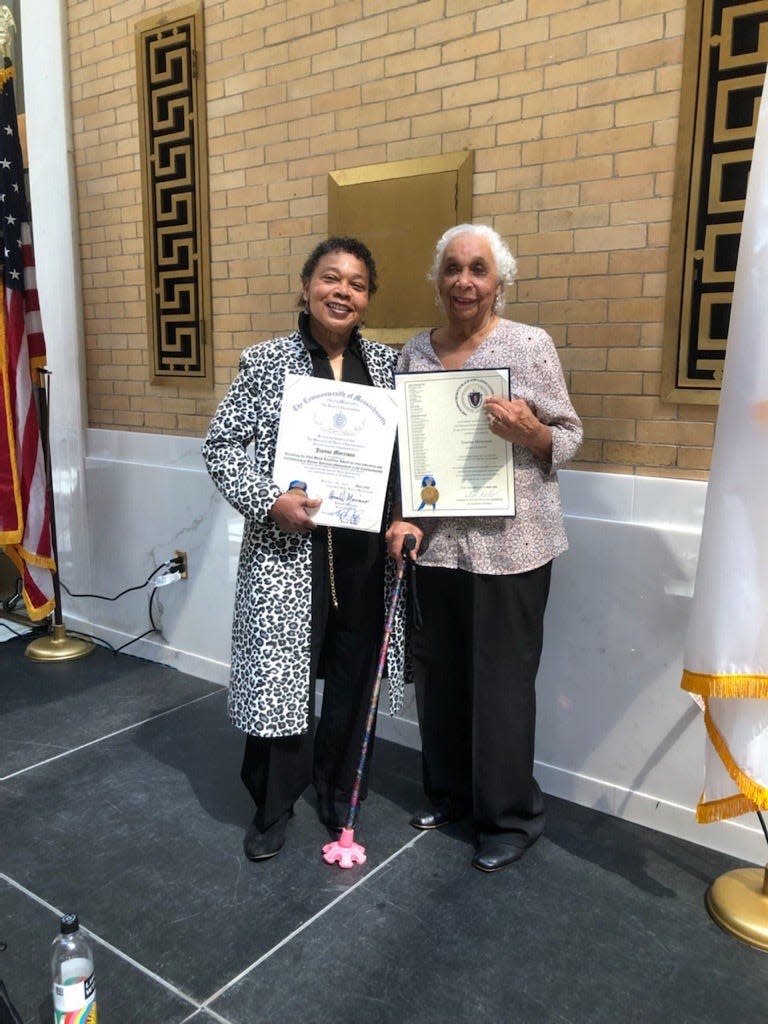 Jeanne Morrison (L) is accompanied by her mother Mary Morrison as she wins a Massachusetts Black & Latino Legislative Caucus' 2023 Black Excellence Award. The ceremony was held Friday, April 14 at the Great Hall of the Massachusetts State House.