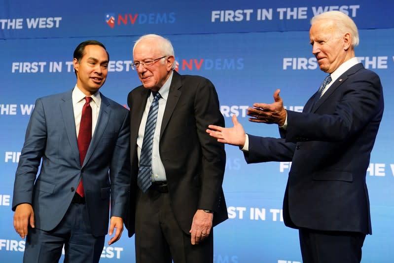 Julian Castro, Bernie Sanders and Joe Biden are pictured on stage at a First in the West Event at the Bellagio Hotel in Las Vegas