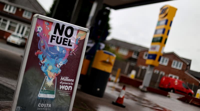 A sign shows customers that fuel has run out at a petrol station