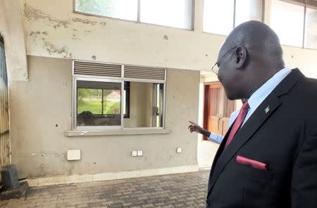 South Sudanese Presidential spokesman Ateny Wek Ateny assesses the damage caused by fighting outside the Presidential State House in South Sudan's capital Juba, July 14, 2016. REUTERS/Stringer