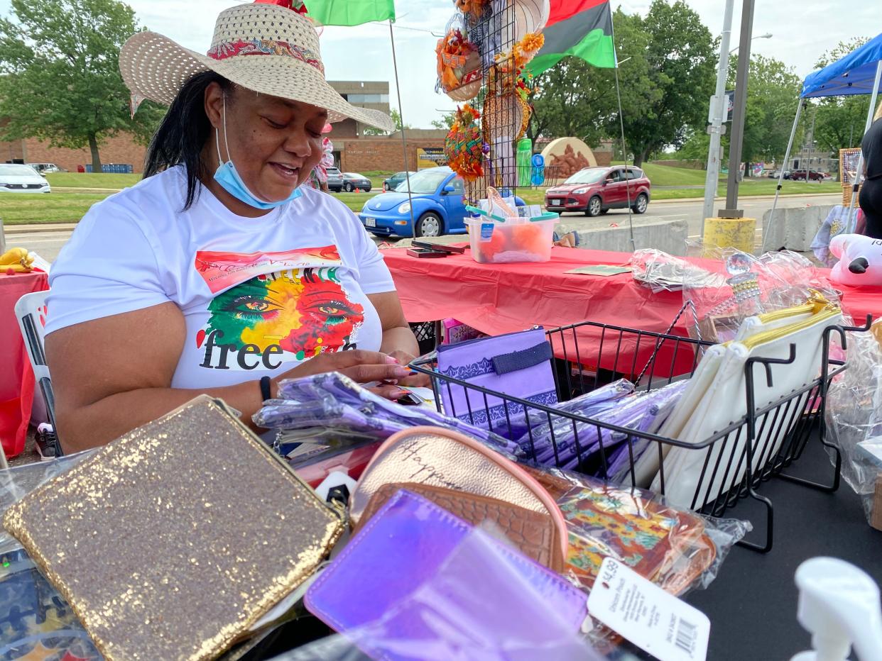 Vendor Veronica Callahan sells her products at a previous African American Arts Festival in Canton. The festival, now in its third year, will be held July 21-22 at Centennial Plaza downtown.