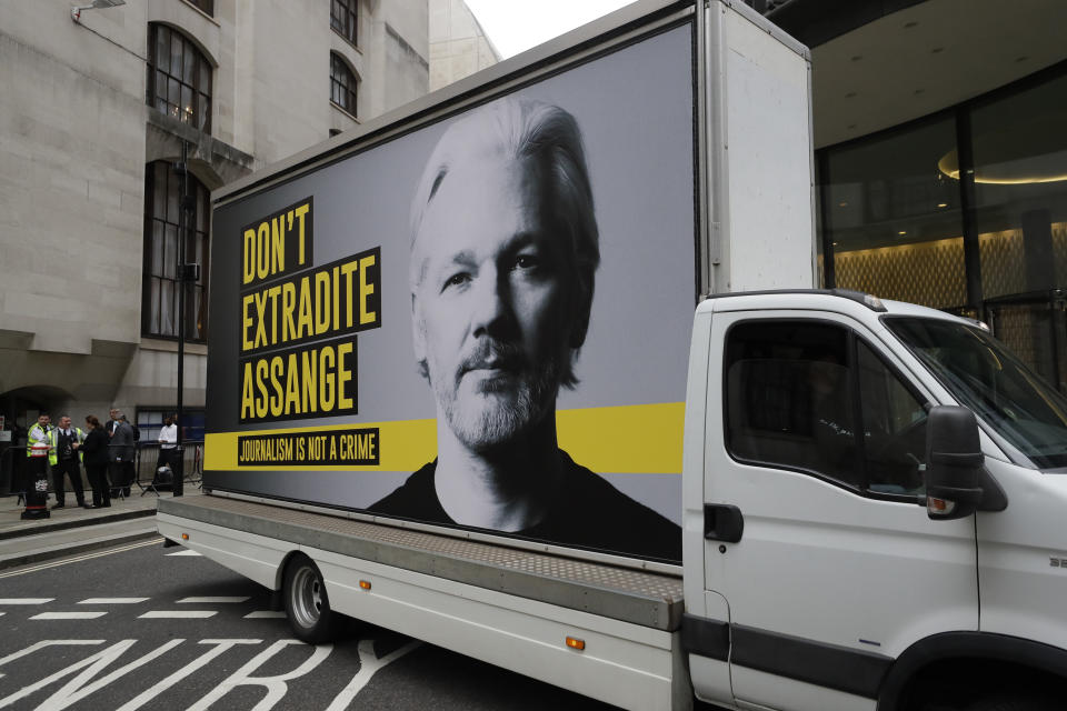 A billboard truck depicting Julian Assange drives past the Central Criminal Court Old Bailey in London, Tuesday, Sept. 8, 2020. Lawyers for WikiLeaks founder Julian Assange and the U.S. government were squaring off in a London court on Monday at a high-stakes extradition case delayed by the coronavirus pandemic. American prosecutors have indicted the 49-year-old Australian on 18 espionage and computer misuse charges over Wikileaks' publication of secret U.S. military documents a decade ago. The charges carry a maximum sentence of 175 years in prison. (AP Photo/Kirsty Wigglesworth)