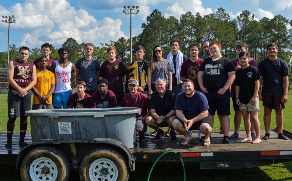 The Washington County High School Football team poses after their team baptism in Chatom, Ala. (Credit: Washington County High School Football team/Facebook)