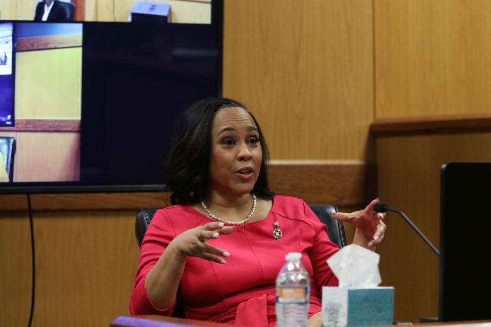 ATLANTA, GA - FEBRUARY 15: Fulton County District Attorney Fani Willis testifies during a hearing in the case of the State of Georgia v. Donald John Trump at the Fulton County Courthouse on February 15, 2024 in Atlanta, Georgia. Judge Scott McAfee is hearing testimony as to whether Willis and Special Prosecutor Nathan Wade should be disqualified from the case for allegedly lying about a personal relationship. (Photo by Alyssa Pointer-Pool/Getty Images)