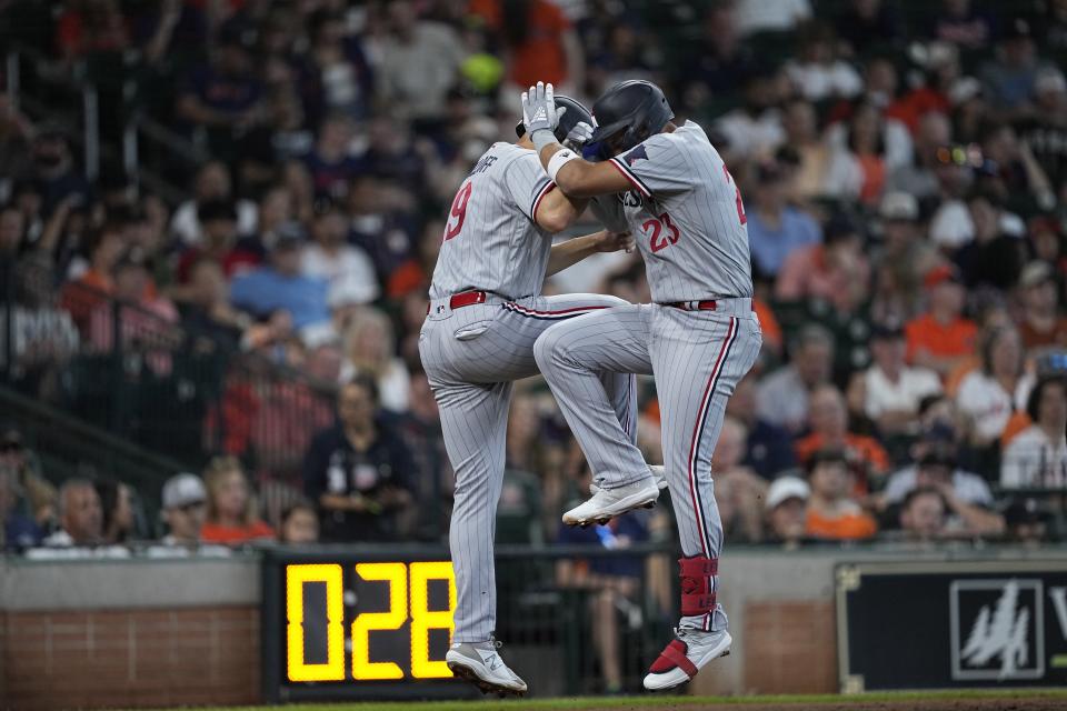 Minnesota Twins' Royce Lewis (23) celebrates with Alex Kirilloff after both scored on Lewis' three-run home run against the Houston Astros during the third inning of a baseball game Monday, May 29, 2023, in Houston. (AP Photo/David J. Phillip)