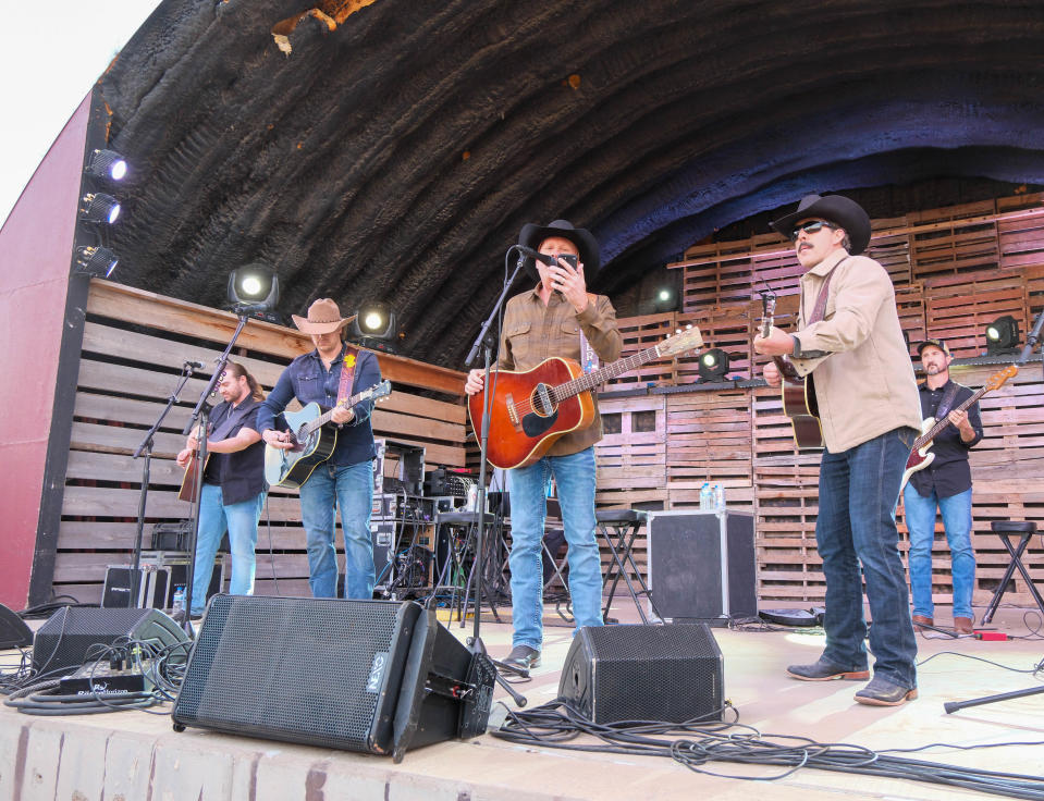 Randall King, left, Kevin Fowler and Aaron Watson perform for the crowd Sunday at the Panhandle Boys: West Texas Relief Concert at the Starlight Ranch in Amarillo.