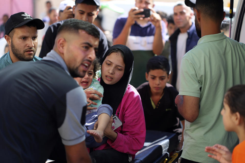 A Palestinian child is brought to the Kuwaiti Hospital after being wounded in the Israeli bombardment of the Gaza Strip, in Rafah refugee camp, southern Gaza, Tuesday, May 7, 2024. (AP Photo/Ramez Habboub)