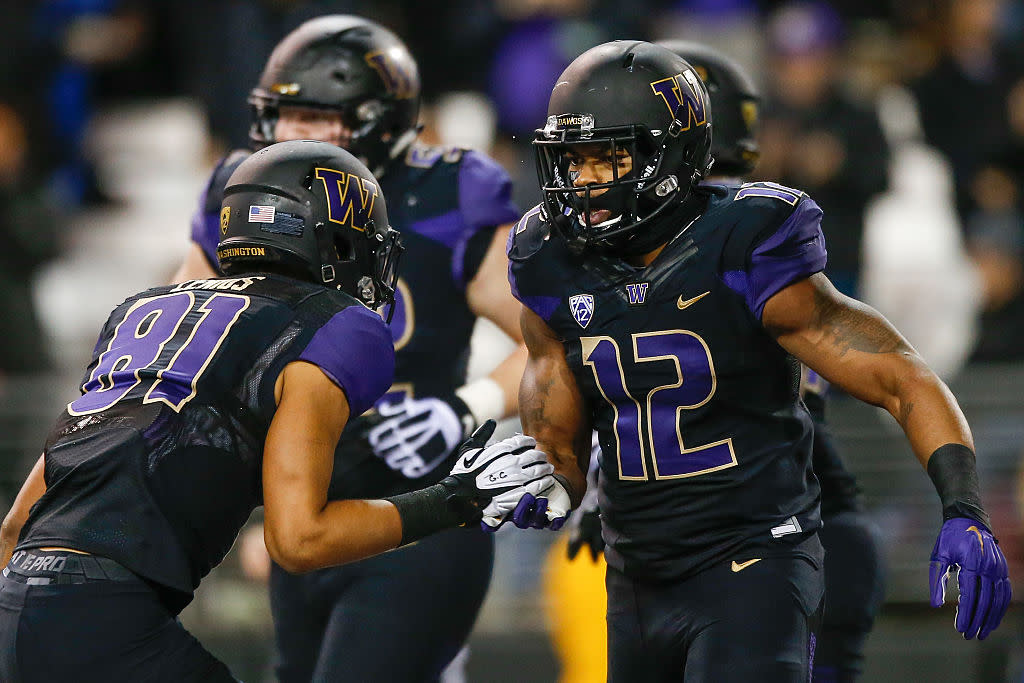 SEATTLE, WA - OCTOBER 31: Fullback Dwayne Washington #12 of the Washington Huskies celebrates with wide receiver Brayden Lenius #81 after scoring a touchdown against the Arizona Wildcats on October 31, 2015 at Husky Stadium in Seattle, Washington. (Photo by Otto Greule Jr/Getty Images)