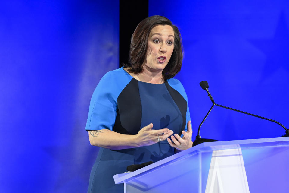 MJ Hegar, of Round Rock, speaks during a debate with Republican U.S. Sen. John Cornyn, of Texas, Friday, Oct. 9, 2020, in Austin, Texas. (Bob Daemmrich/Nexstar/KXAN via AP, Pool)