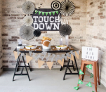 <p>Adding a festive "touchdown" backdrop to your food spread will encourage guests to keep snacking throughout the game. </p><p><a href="https://love-the-day.com/football-game-food" rel="nofollow noopener" target="_blank" data-ylk="slk:Get the tutorial at Love the Day »;elm:context_link;itc:0;sec:content-canvas" class="link "><em>Get the tutorial at Love the Day »</em></a></p>