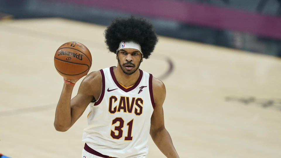 Cleveland Cavaliers' Jarrett Allen looks to pass in the first half of an NBA basketball game against the Oklahoma City Thunder, Sunday, Feb. 21, 2021, in Cleveland. 