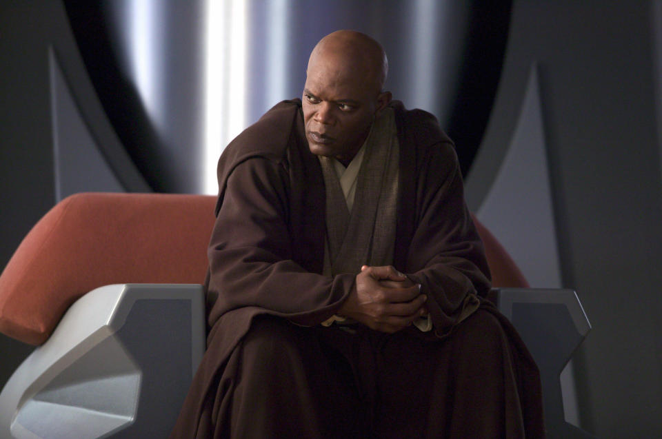 Samuel L. Jackson as Mace Windu, dressed in Jedi robes, seated on a futuristic chair in a scene from Star Wars