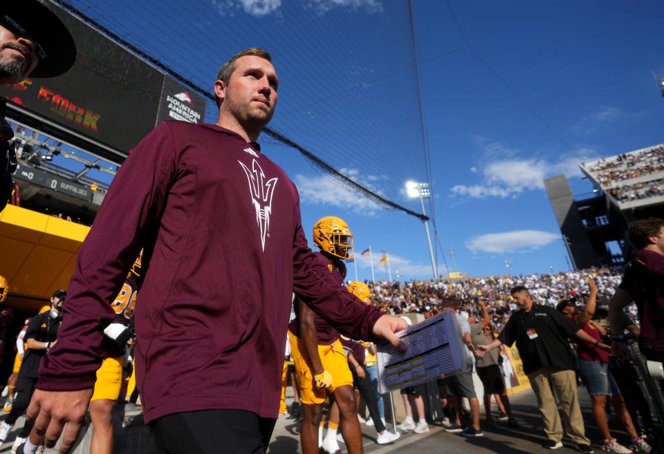 ASU Sun Devils head coach Kenny Dillingham leads his team onto the field to play against the Colorado Buffaloes at Mountain America Stadium in Tempe on Oct. 7, 2023.