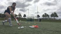 Brushing up with the best: Pro field hockey athletes lead players clinic