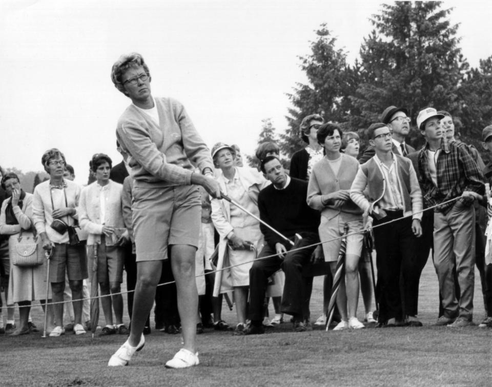 FILE - In this 1967 file photo, the gallery follows Mickey Wright's iron shot from the fairway at the Toronto Golf Club. Hall of Fame golfer Wright, who won 82 LPGA tournaments including 13 majors, died Monday, Feb. 17, 2020, of a heart attack, her attorney said. Wright was 85. (AP Photo, File)