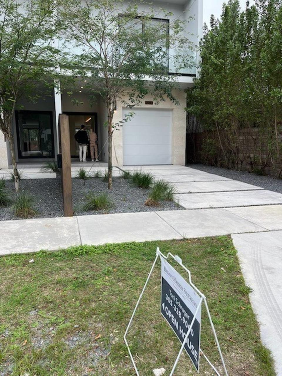 An open-house sign sits in front of one of the townhouses for sale on Coconut Avenue in Coconut Grove built by Doug Cox.
