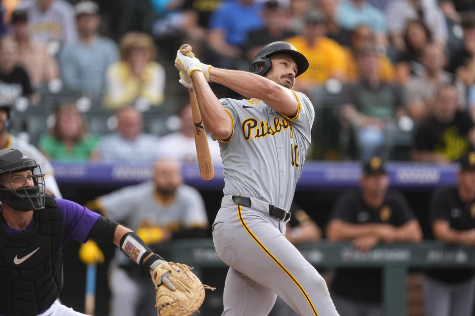 Pittsburgh Pirates' Bryan Reynolds watches his solo home run off Colorado Rockies starting pitcher Ryan Feltner during the first inning of a baseball game Friday, June 14, 2024, in Denver. (AP Photo/David Zalubowski)