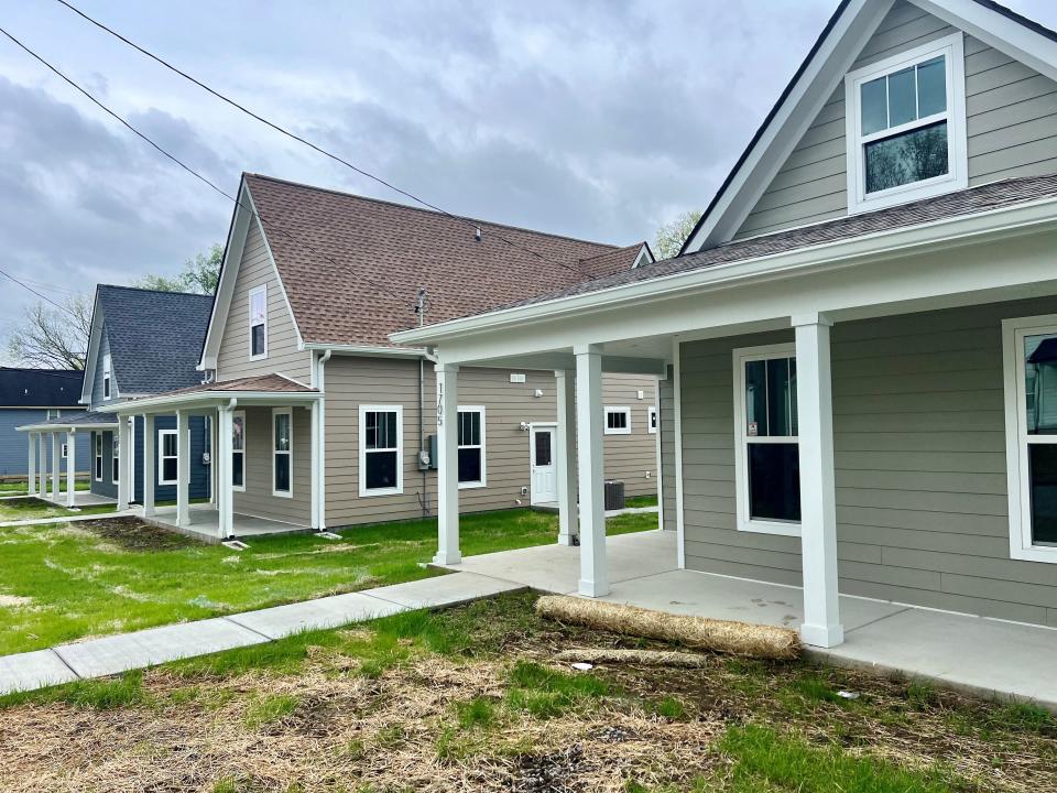 Three new homes in North Nashville on April 10, 2024, that were built by women's recovery nonprofit Thistle Farms to be purchased by its program graduates