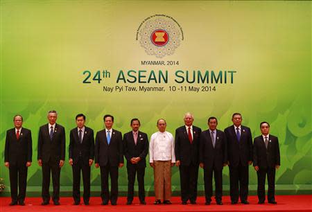 ASEAN leaders pose for pictures during the opening ceremony of the 24th ASEAN Summit in Naypyidaw May 11, 2014. REUTERS/Soe Zeya Tun